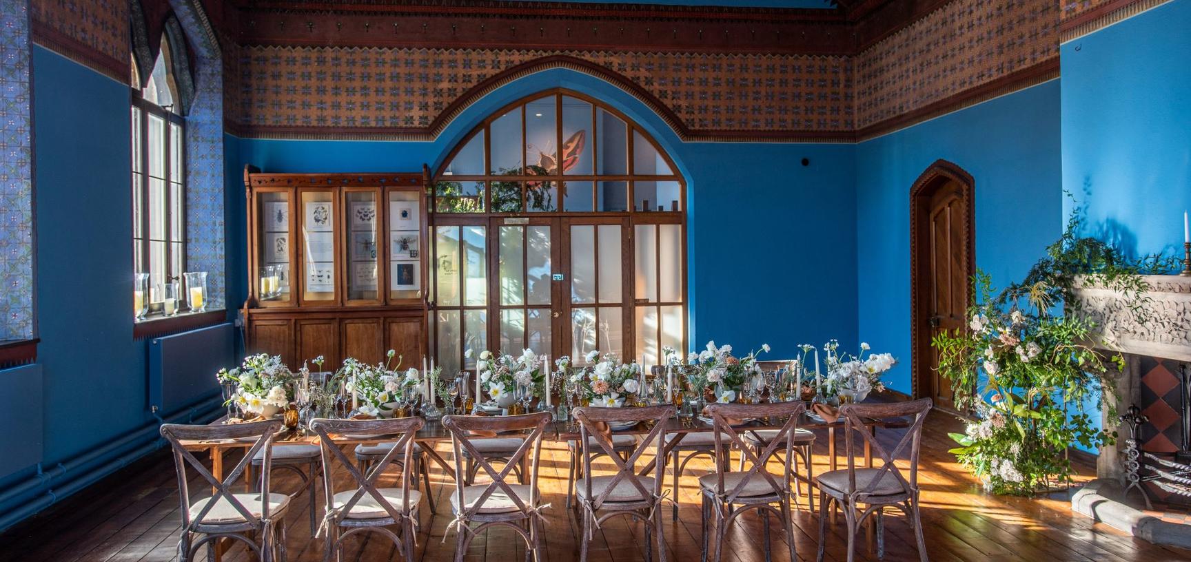 A long table set up in the Westwood Room for a wedding breakfast