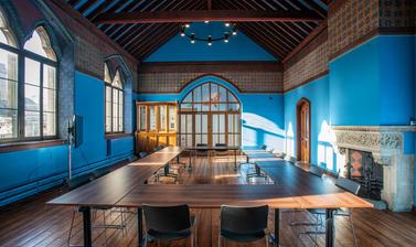 The Westwood room with tables and chairs arranged for a conference