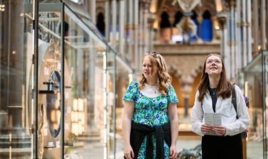 Two visitors looking at the displays in the Museum's main court