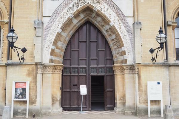 The Main entrance of the Museum, a large set of wooden doors with nature stone carvings around them